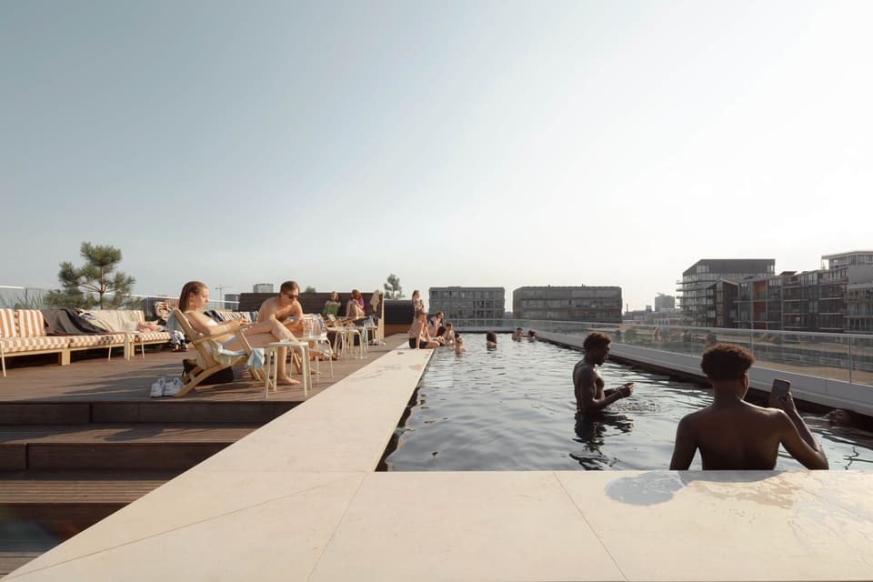 Residents sunbathing and swimming at the rooftop pool